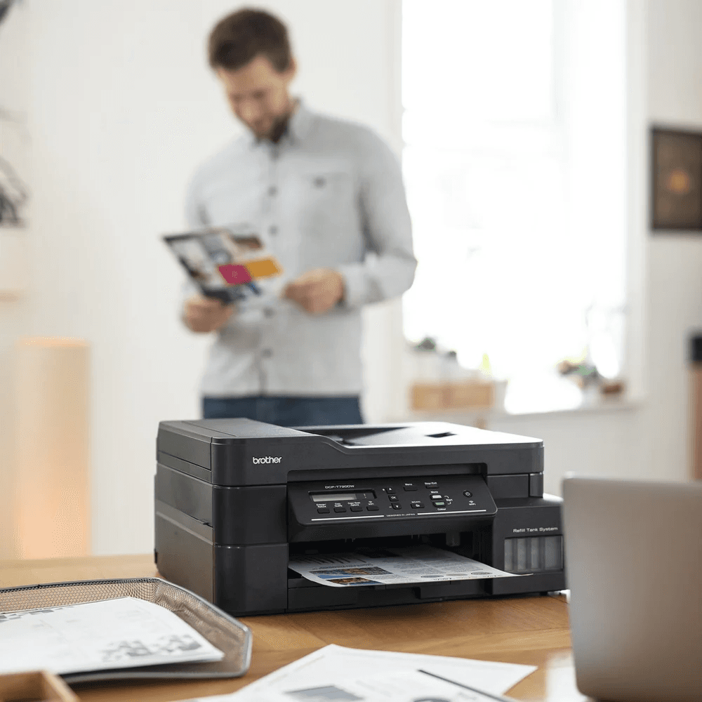 a printer in front of a guy